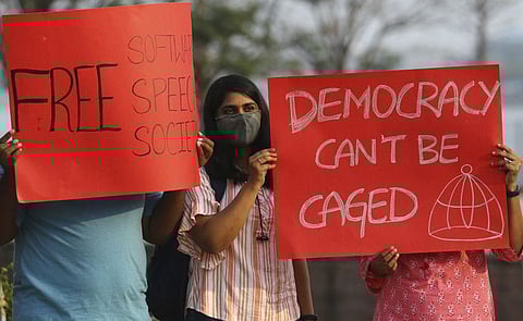 Activists participate in a silent protest against the arrest of environmental activist Disha Ravi in Hyderabad, India, Saturday, February 20, 2021.