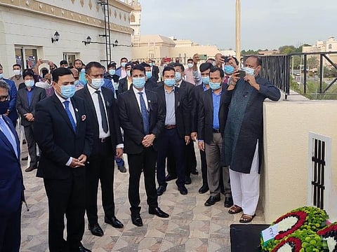 Mohammad Abu Zafar, Bangladeshi Ambassador and Md Shahriar Alam, Bangladeshi State Minister for Foreign Affairs, lay a floral wreath at a Martyr's Monument model at the Bangladeshi Embassy in Abu Dhabi on the occasion of International Mother Language Day on Sunday.