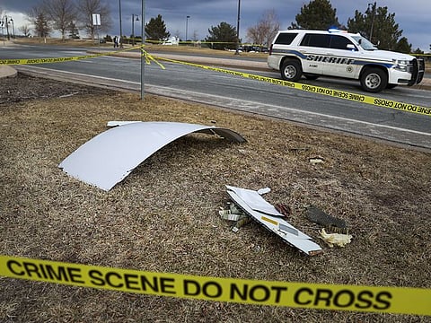 Pieces of an airplane engine from Flight 328 sit scattered in a neighborhood on February 20, 2021 in Broomfield, Colorado. An engine on the Boeing 777 exploded after takeoff from Denver prompting the flight to return to Denver International Airport where it landed safely.