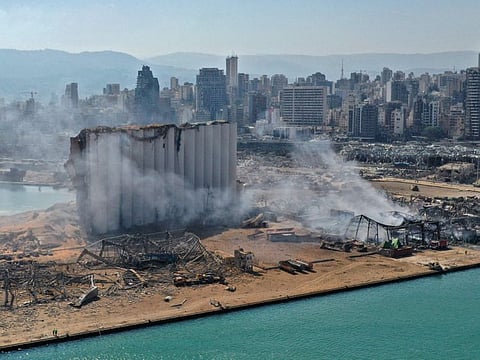 A file aerial view taken on August 5, 2020 shows the massive damage done to Beirut port's grain silos (centre) and the area around it, one day after a mega-blast tore through the harbour in the heart of the Lebanese capital with the force of an earthquake.