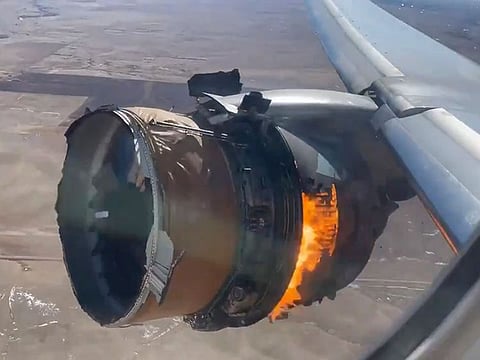 The engine of United Airlines Flight 328 is on fire after after experiencing "a right-engine failure" shortly after takeoff from Denver International Airport, Saturday, Feb. 20, 2021, in Denver, Colo.