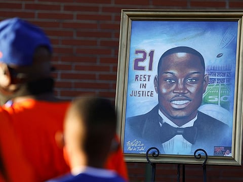 A portrait of Ahmaud Arbery, an unarmed young Black man shot and killed after being chased by a white former law enforcement officer and his son, is pictured during a candle light vigil to mark the one year anniversary of his death, at New Springfield Baptist Church in Waynesboro, Georgia, U.S. February 23, 2021