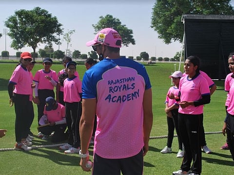 Coach George Cremer with students at the Rajasthan Royals Academy UAE at Dubai Sevens