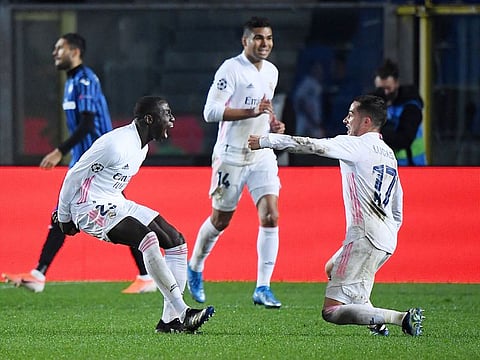 Real Madrid's Ferland Mendy celebrates scoring their first goal with Lucas Vazquez.