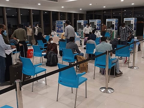 Passengers at Kannur International Airport in Kerala where special kiosks have been set up for on-arrival COVID-19 tests