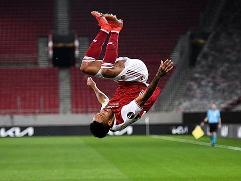 Arsenal's Pierre-Emerick Aubameyang celebrates after scoring his side's third goal during the Europa League round of 32, second leg match against Benfica at Georgios Karaiskakis Stadium in Athens on Thursday.