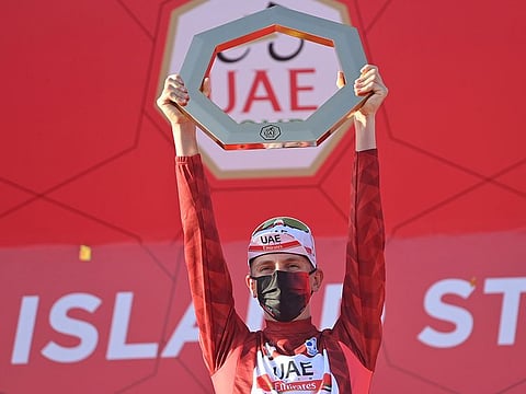 Tadej Pogacar with the UAE Tour winner's trophy on Saturday.