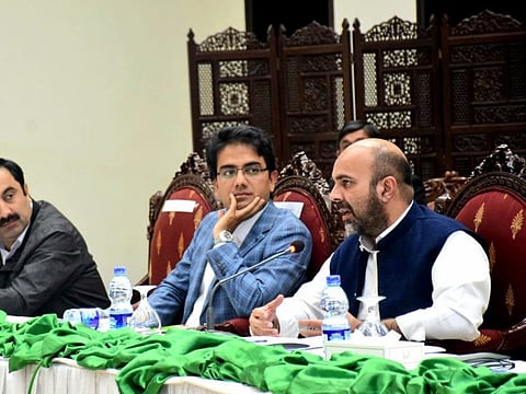Taimur Khan Jhagra (first from right)