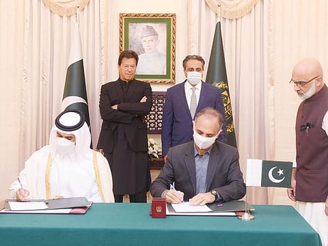 Prime Minister Imran Khan witnesses the signing of the memorandum of understanding (MoU) on LNG between Pakistan and Qatar on Friday.