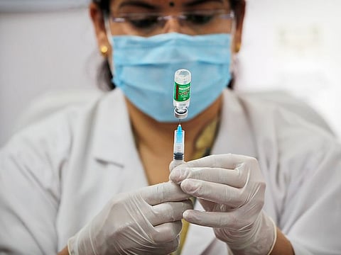 A health worker prepares to administer a COVID-19 vaccine at a hospital in New Delhi. India has expanded its COVID-19 vaccination drive, beyond health care and frontline workers to the general population. Now, those who are older than 60 and people, above the age of 45 — with ailments like heart disease or diabetes that make them vulnerable to the virus — can get the shots.