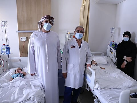 Dr Hussein Matlik with Rashid Al Hasani, Mona Ali and the twin babies.