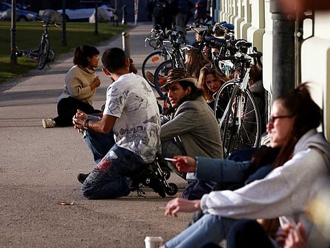 People sunbathe as the coronavirus disease (COVID-19) outbreak continues, in Vienna, Austria, March 1, 2021.