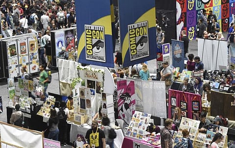 Comic-Con attendees walk the convention center floor during preview night at Comic-Con International on July 17, 2019, in San Diego, California.