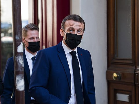 Emmanuel Macron, France’s president, wears a protective face mask while walking in the Montmartre district in Paris, France, on Monday, March 1, 2021.