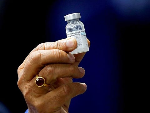Indian Health Minister Harsh Vardhan holds a dose of Bharat Biotech's COVID-19 vaccine called Covaxin, during a vaccination campaign at All India Institute of Medical Sciences (AIIMS) hospital in New Delhi, India, January 16, 2021.