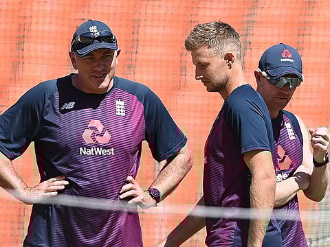 England captain Joe Root (C) walks past head coach Chris Silverwood (L) during a practice session ahead of the fourth Test vs India  at the Narendra Modi Stadium in Motera on March 3, 2021.