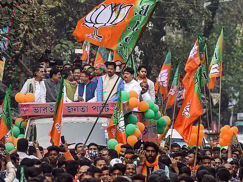 BJP leaders Suvendu Adhikari, Mukul Roy, Rajeev Banerjee and others during a roadshow for upcoming polls, in Kolkata recently.