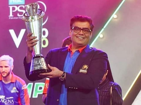 Salman Iqbal, owner of Karachi Kings, poses with the PSL trophy after his team won the title last year.
