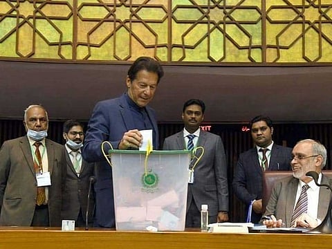 Pakistan Prime Minister Imran Khan votes during the Senate elections on Wednesday, March 3, 2021.