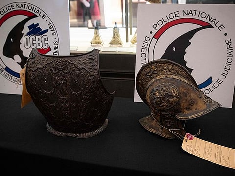 This picture taken on March 3, 2021, shows a breastplate and a ceremonial helmet during their official restitutions by the French Central Directorate of the Judicial Police (DCPJ) to the Louvre Museum, in Paris.