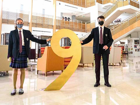 Brighton College, Dubai, students Madeleine Cranitch and Ross Bannerman, who received 9 grades.