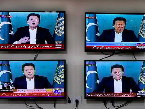 Various Pakistani news channels broadcast a live address to the nation by Pakistan's Prime Minister Imran Khan, at the office of The Associated Press, in Islamabad, Pakistan Thursday, March 4, 2021.