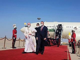 Photos: Pope Francis lands in Baghdad, beginning the first-ever papal trip to Iraq