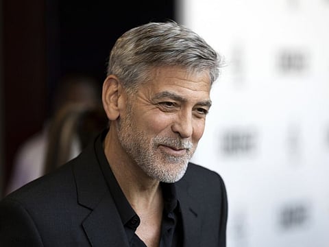 Actor George Clooney talks to reporters on arrival at the premiere of the television mini-series 'Catch22', in London, Wednesday, May 15, 2019.