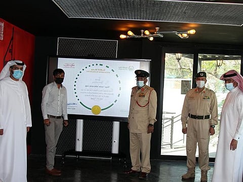 Mohammad Orfan Mohammad Rafeeq being honoured by Dubai Police. Rafeeq had handed over the large sum of money to the nearest police station.