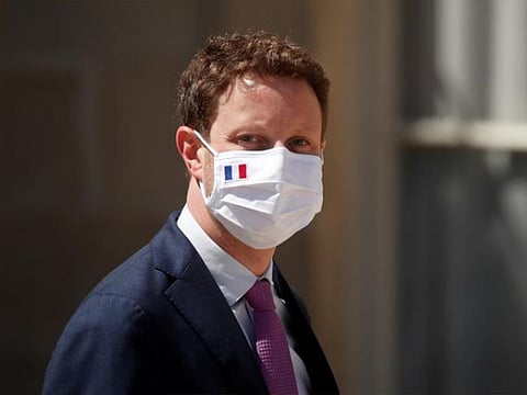 France's Europe minister, Clement Beaune, wearing a protective face mask, leaves following a weekly Cabinet meeting at the Elysee Palace in Paris, France.