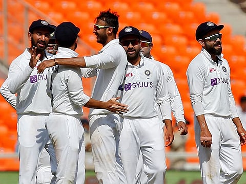Axar Patel celebrates a wicket against England with India teammates