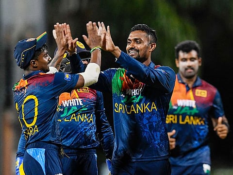 Danushka Gunathilaka (R) of Sri Lanka celebrates the dismissal of Jason Holder of West Indies during the 2nd T20I match at Coolidge Cricket Ground on March 5, 2021 in Osbourn, Antigua and Barbuda.