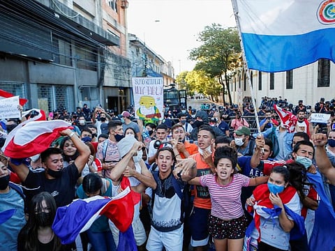 The riots, which turned the capital’s historic center into a make-shift battlefield of fire, smoke and gunshots, broke out amid growing outrage as coronavirus infections hit record levels and hospitals verged on collapse throughout the South American nation.
