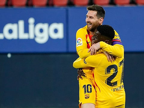 Barcelona's Messi and Moriba celebrate goal.