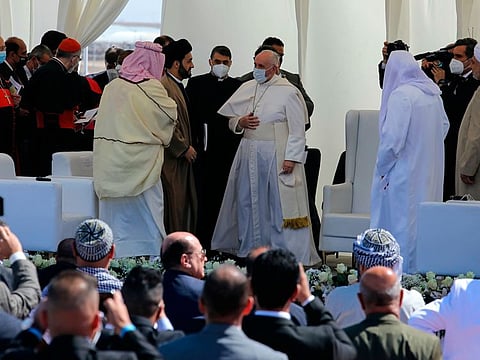 Pope Francis at an inter-religious meeting near the archaeological site of Ur near Nasiriyah, Iraq, Saturday, March 6, 2021. Pope Francis delivered a powerful message of peaceful coexistence, urging Muslims in the war-weary nation to embrace Iraq's long-beleaguered Christian minority during a historic meeting in the holy city of Najaf