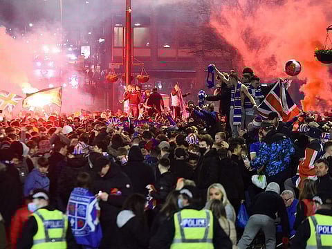 Rangers fans break COVID lockdown rules to celebrate in George Square, Glasgow