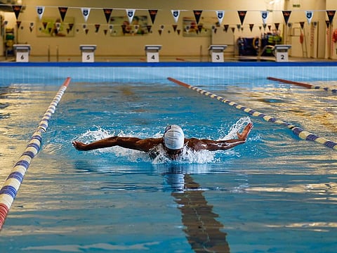 A student trains at the Swimming Centre of Excellence at GEMS Wellington Academy — Al Khail