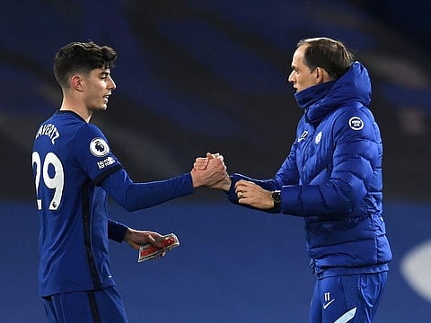 Chelsea manager Thomas Tuchel shakes hands with Kai Havertz after the match.