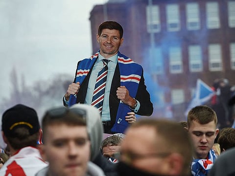 Fans hold aloft a life-size cut-out of Steven Gerrard after Rangers won the Scottish Premiership title