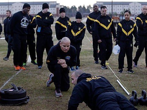 Army troops observing a demonstration of new requirements for the fitness test at Fort Bragg in 2019.
