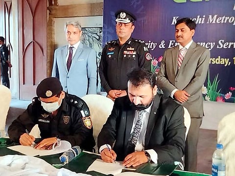Officials of Karachi Metropolitan Corporation and Special Security Unit of Sindh Police sign MoU at Frere Hall in Karachi.