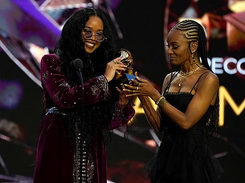H.E.R, left, and Tiara Thomas accept the award for song of the year for "I Can't Breathe" at the 63rd annual Grammy Awards at the Los Angeles Convention Center on Sunday, March 14, 2021.