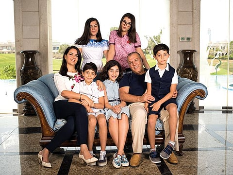 Ghassan Aboud seen with his family at their home in Dubai