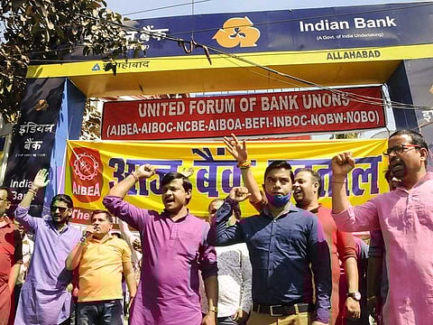 Employees of Allahabad Bank stage a protest during a two-day nationwide banks' strike against the privatisation of Public Sector Banks and retrograde banking reforms, in Patna, Monday, March 15, 2021.