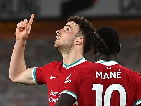 Liverpool's Diogo Jota celebrates scoring with Sadio Mane.