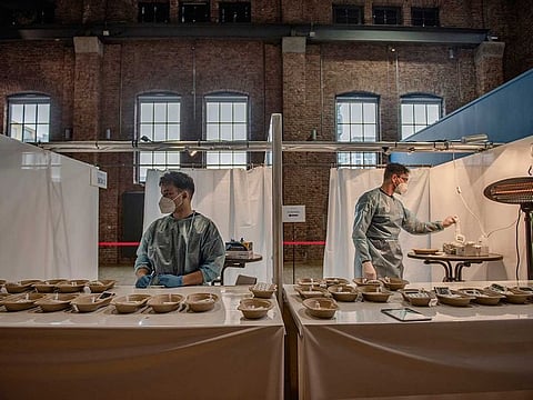 Healthcare workers provide free coronavirus testing for citizens in Munich, March 15, 2021.