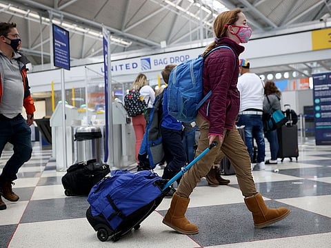 Officials say people who haven't gotten the shots should delay travel.