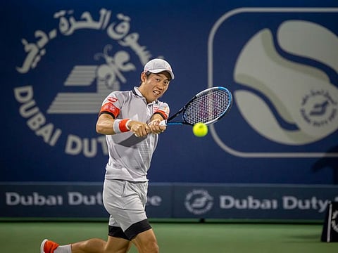 Kei Nishikori of Japan sealed a berth in the quarter finals in Dubai to stay in his pursuit of breaking into top-10 again.