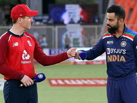 Will toss hold the key again? Rival captains Eoin Morgan and Virat Kohli after flip of the coin on Thursday.