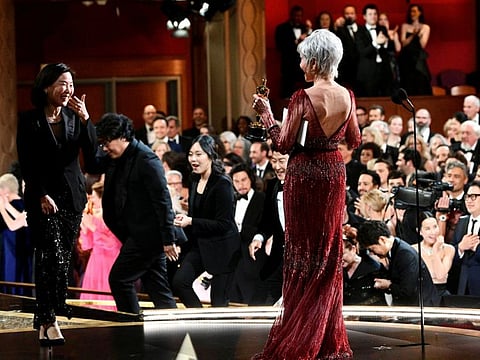 Jane Fonda gives the Best Motion Picture Oscar statue to Kwak Sin Ae and Bong Joon Ho at the 92nd Academy Awards in Hollywood, Los Angeles, California, US, February 9, 2020.